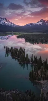 A stunning purple sunset over a lake with mountain reflections.