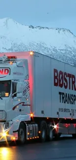 Bøstrand transport truck with snowy mountain background.