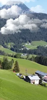 Scenic mountain valley with lush greenery and clouds.