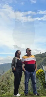 Couple enjoying a mountain view with a clear, blue sky.