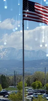 American flag with mountains and blue sky in the background, perfect for mobile wallpaper.