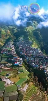 Aerial view of a mountain village with lush green fields.