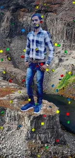 Person standing on rugged cliff overlooking a scenic river canyon.