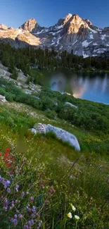 Scenic mountain landscape with lake, greenery, and bright wildflowers.