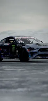 Ford Mustang drifting on snowy terrain under a gray-blue sky.