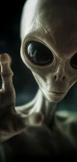 Mysterious alien reaching out in dark wallpaper.