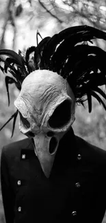 Eerie bird skull mask with black feathers in a monochrome setting.