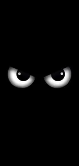 A pair of intense, mysterious eyes on a black background.