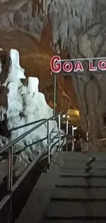 Cave entrance with rock formations and subdued lighting.