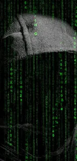 Mysterious hooded figure in green code matrix on dark background.