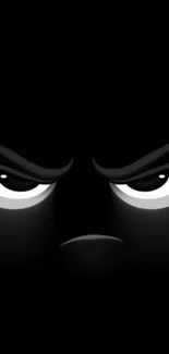 Mysterious dark eyes staring intensely on a black background.