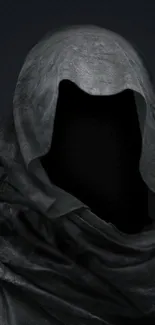 Mysterious dark hooded figure on a black background.