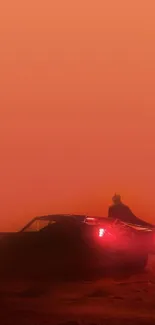 Silhouette of a car in an orange desert.