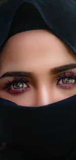 Veiled woman with captivating eyes in focus.