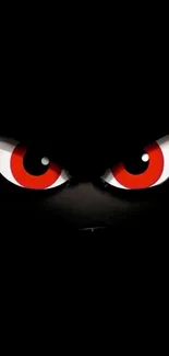 Mysterious wallpaper featuring intense red eyes against a dark background.