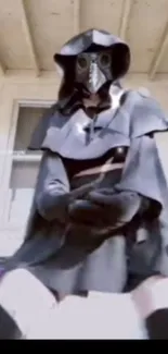 A mysterious hooded figure wearing a plague mask, set against a white background.