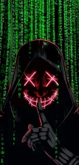 Hooded figure with neon smile amid green digital code.