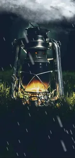 A glowing vintage lantern in rain on dark grass.