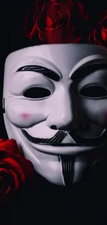 Mysterious mask with vibrant red roses on a dark background.