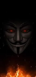 Mysterious dark mask with glowing eyes and fiery background wallpaper.