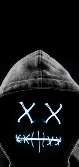 Wallpaper of a hooded figure with neon lights on a black background.