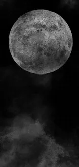 Mysterious moon in a cloudy night sky creating a captivating mobile wallpaper.