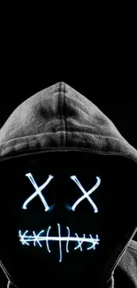 Dark hooded figure with neon mask design wallpaper.