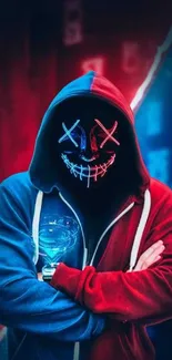 Hooded figure with neon mask in blue and red glow.