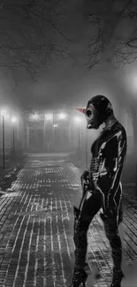 Gray-toned wallpaper with masked figure on a foggy night street.