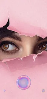 Mysterious eyes peeking through pink torn paper wallpaper.