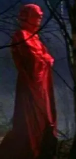 A red-cloaked figure stands mysteriously in a dark forest landscape.