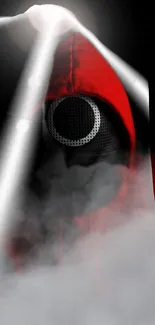 Mysterious figure in red hooded attire with smoky effect.