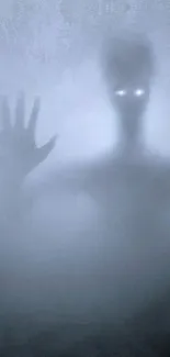 Mysterious shadowy figure with glowing eyes on foggy wallpaper background.