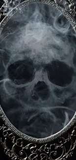 Intricate silver skull in smoke-filled mirror on black background.