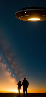 UFO hovers above a couple against a starry night skyline.