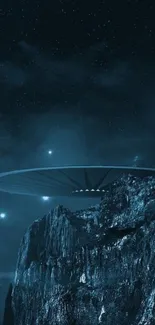 UFO over rocky mountains under a star-filled night sky.