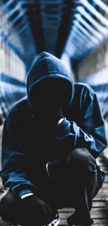 Hooded figure on a wooden bridge with blue architecture in the background.