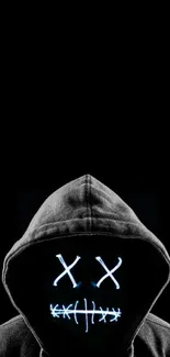 Hooded figure with glowing neon face on dark background.