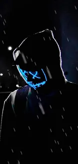 Shadowy figure in a glowing mask with a dark background.