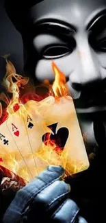 Anonymous mask with fiery playing cards.