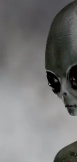 Close-up of a mysterious alien figure in gray tones on mobile wallpaper.