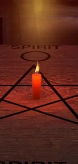 Candle glowing on pentagram in dark wooden setting.