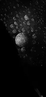 Black and white abstract wallpaper with water droplets and moon-like sphere.