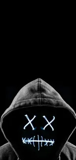 Hooded figure with a glowing face on a black background.