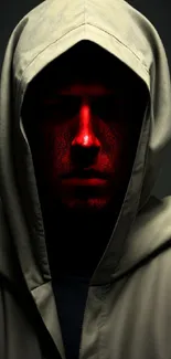 A mysterious hooded figure with a red illuminated face on a dark background.