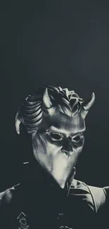 Mysterious metallic mask with dramatic lighting on wallpaper.