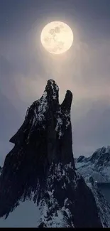 Dark mountain peak under a glowing full moon with a tranquil night sky.