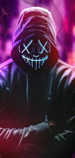 Hooded figure with neon mask wallpaper