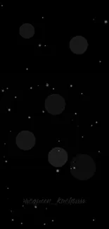 Minimalist black wallpaper with stars and glowing circles.