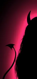 Silhouette of a figure with horns in pink glow.